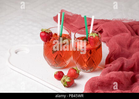 Lemonade with strawberry glass on a white background Stock Photo