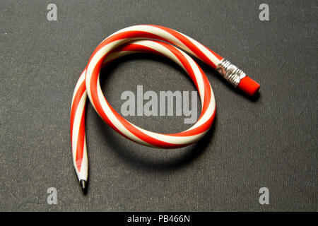 Flexible pencil on a  background. Bent pencils  two-color Stock Photo