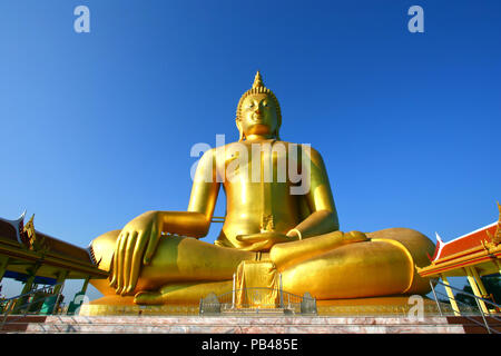 big golden Buddha statue with a blue sky, Thailand Stock Photo