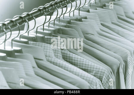 Luxury color tone of Men Shirts On Hanger Stock Photo