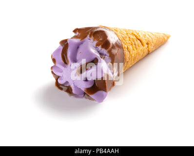 mini sweet potato flavor ice cream cone in a melting process on blue background Stock Photo