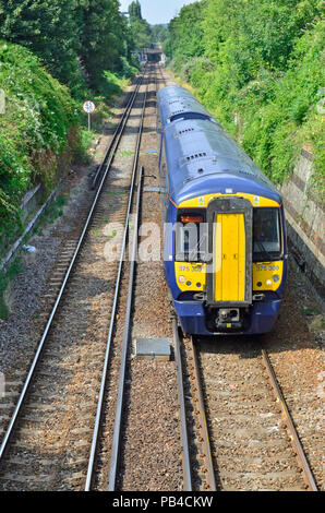 British Rail Class 375 two unit train in a cutting between Maidstone Barracks and Maidstone West stations, Kent, England. Stock Photo