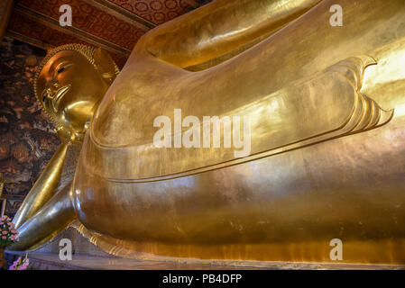 Big golden reclining Buddha of Wat Pho temple in Bangkok, Thailand.