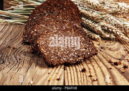 bread on wooden board from above. Kitchen or bakery poster design. Stock Photo