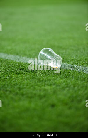 Plastic trash can on the turf on a soccer field Stock Photo