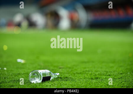 Plastic trash can on the turf on a soccer field Stock Photo