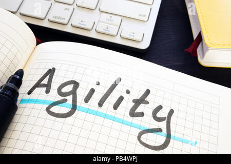 Agility written by hand in a note. Stock Photo