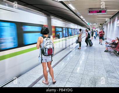 Athens, Greece - June 29, 2018. Tourists waiting for a train in a Athens Metro station. Stock Photo