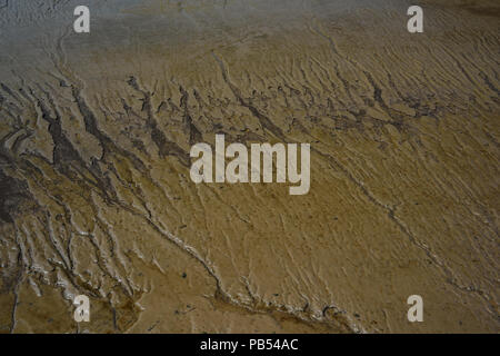 Mud in Watchet harbour at low tide. Stock Photo