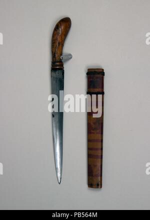 Dagger with Sheath. Culture: Philippine, Mindanao. Dimensions: L. with sheath 11 1/8 in. (28.3 cm); L. without sheath 11 in. (27.9 cm); L. of blade 7 1/2 in. (19.1 cm); W. 1 in. (2.5 cm); Wt. 3.4 oz. (96.4 g); Wt. of sheath 1.4 oz. (39.7 g). Date: 18th-19th century. Museum: Metropolitan Museum of Art, New York, USA. Stock Photo