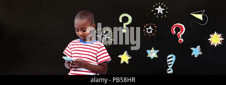 School boy and Question marks and stars drawing on blackboard Stock Photo