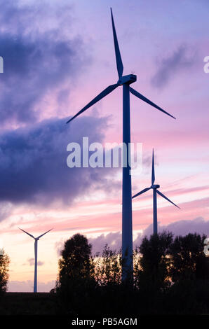 wind turbines before blue sky Stock Photo