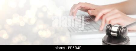 Gavel and keyboard on laptop with transition Stock Photo