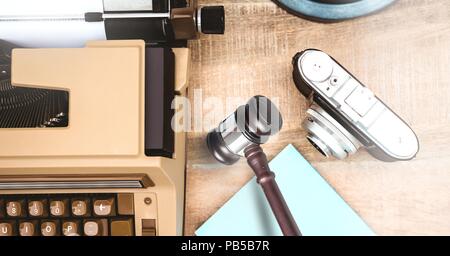 Gavel camera and typewriter on desk Stock Photo