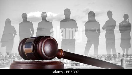 Gavel and people silhouettes over city Stock Photo