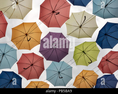 Colorful umbrellas on clear sky background Stock Photo