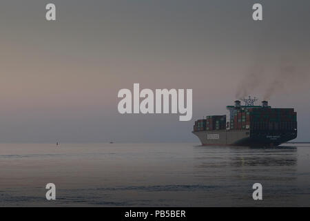 The Giant EVERGREEN Container Ship, EVER ENVOY Leaving The Port Of Los Angeles As She Heads For The Pacific Ocean, California, USA. Stock Photo