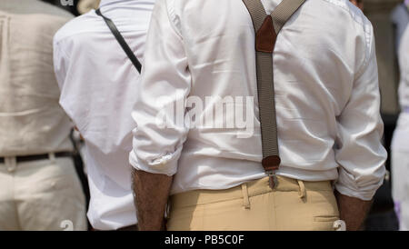 Rear view of a man wearing suspenders Stock Photo