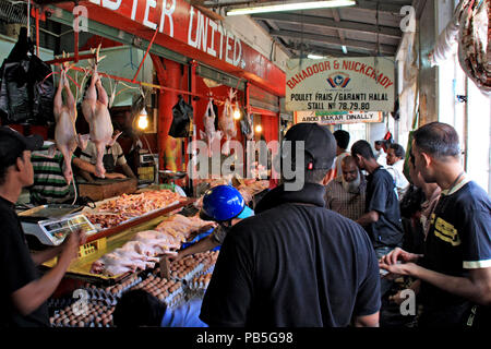 Eggs, and dead chicken for sale at a stall in the poultry market hall in Port Louis Stock Photo