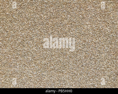 Wall of small stones, background or unusual texture. Stock Photo