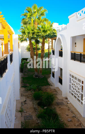 Sharm el-Sheikh, Egypt - March 14, 2018. The courtyards of a magnificent white hotel in the morning. Sunrise. The concept tourism, vacations and luxur Stock Photo