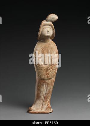 Figure of a Court Lady. Culture: China. Dimensions: H. 14 5/8 (37.1 cm); W. 4 1/2 in. (11.4 cm); D. 3 1/4 in. (8.3 cm). Date: 8th century. Museum: Metropolitan Museum of Art, New York, USA. Stock Photo