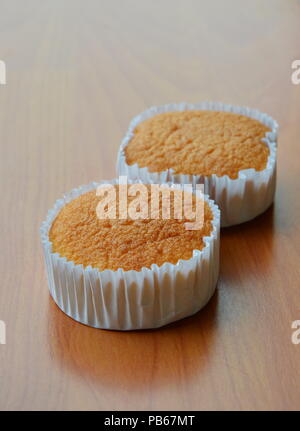 butter cupcake on paper tray Stock Photo