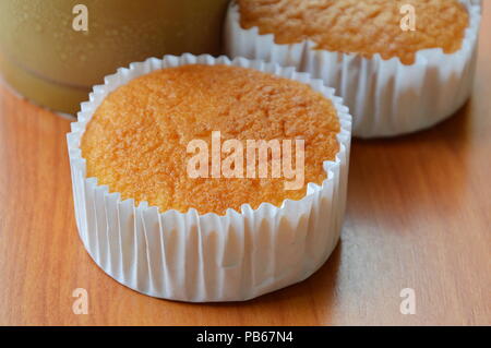 butter cupcake and ice coffee on table Stock Photo