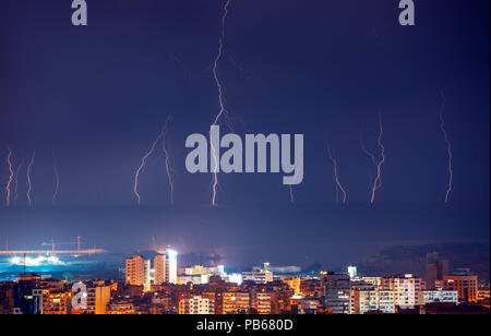 Beautiful landscape of lightning among the dark blue sky above the night city, thunderstorm Stock Photo