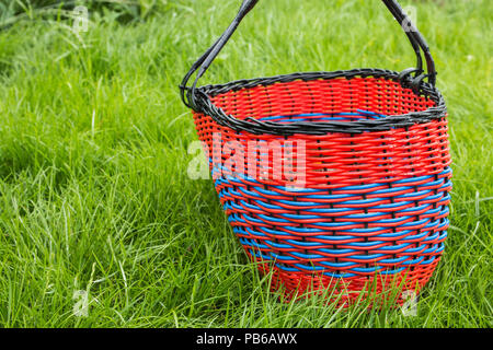 wicker empty basket for products on grass Stock Photo