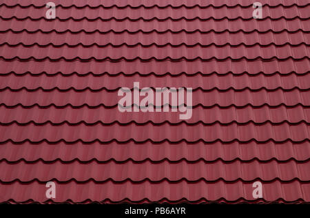 Red roofing from stainless metal plate, metal tile Stock Photo