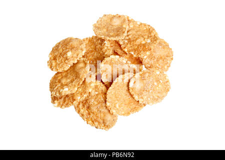 Small sampling of corn flake cereal in a pile isolated against a white background Stock Photo