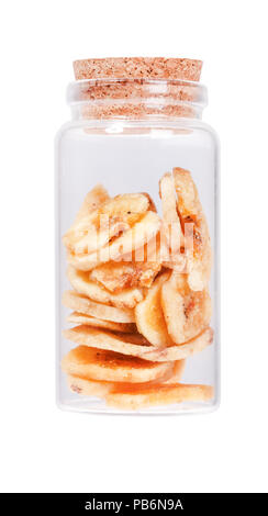 Banana chips in a glass bottle with cork stopper, isolated on wh Stock Photo