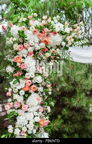 Magnificent fresh wedding flowers. High vertical composition from flowers on a wedding arch Stock Photo