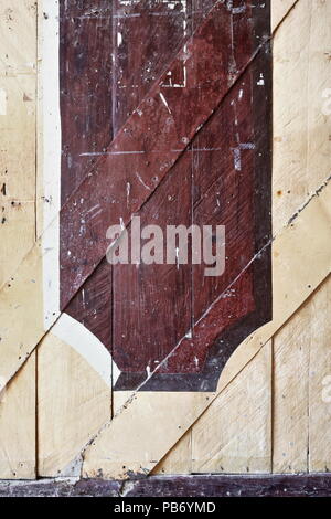 Decoration on the inner side of the wooden plank left swing of the gates giving entrance directly to the main nave of the Santa Monica Parish Church.  Stock Photo