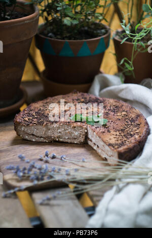 Soft homemade cheesecake (cottage cheese pie, casserole, zapekanka) vanilla chocolate with cinnamon on a cutting board. Selective focus Stock Photo