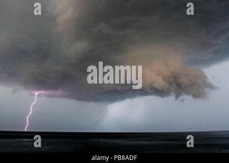 Lightning Bolt coming from Dark Storm Clouds/ Thunderstorm Clouds with Lightning Stock Photo