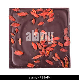 Black bitter chocolate with goji berries. Studio Photo Stock Photo