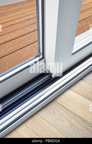 Sliding glass door detail and rail embed in floor Stock Photo