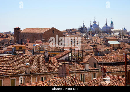 Venice roofs, bricks buildings and San Marco basilica domes in summer, Italy Stock Photo