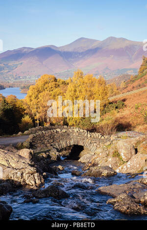 Ashness Bridge crossing a mountain stream and trees in autumn in the English Lake District National Park Keswick Borrowdale Cumbria England UK Britain Stock Photo