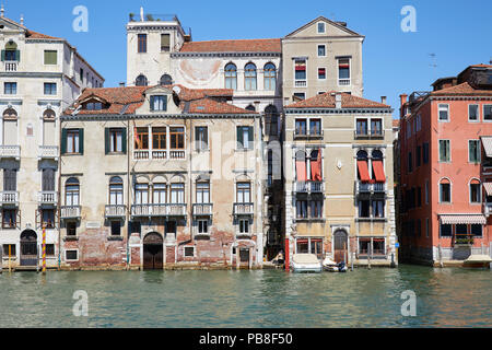 Venice buildings facades and canal in a sunny day in Italy, nobody Stock Photo