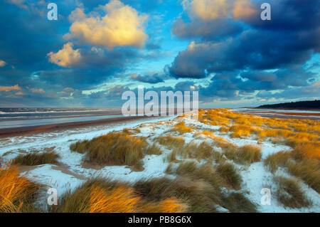 Sunset on Holkham Beach with a dusting of snow, Norfolk, England, UK, January 2010. Stock Photo