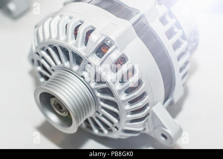 Power generator on white background. Car part engineering. Light photo Stock Photo
