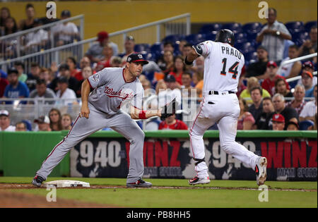 Miami, Florida, USA. 26th July, 2018. Washington Nationals first baseman Ryan Zimmerman (11) takes out on first Miami Marlins third baseman Martin Prado (14) in the sixth inning during a MLB game between the Washington Nationals and the Miami Marlins at the Marlins Park, in Miami, Florida. The Nationals won 10-3. Mario Houben/CSM/Alamy Live News Stock Photo