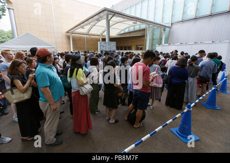 Tokyo, Japan. 27th July, 2018. Visitors line up outside the Ueno Royal Museum to see ''The Miracle of M.C. Escher Prints from The Israel Museum, Jerusalem'' exhibition on July 27, 2018, Tokyo, Japan. The exhibition introduces a selection of 150 works (selected from The Israel Museum) of the Dutch graphic artist Maurits Cornelis Escher at Ueno Royal Museum until July 29. (Photo by Rodrigo Reyes Marin/AFLO) Credit: Aflo Co. Ltd./Alamy Live News Stock Photo