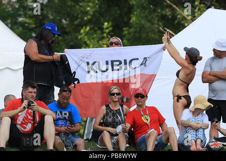 Hungaroring, Mogyorod, Hungary. 27th July, 2018. Hungarian Formula One Grand Prix, Friday free practice; Robert Kubica supporters with a flag Credit: Action Plus Sports/Alamy Live News Stock Photo