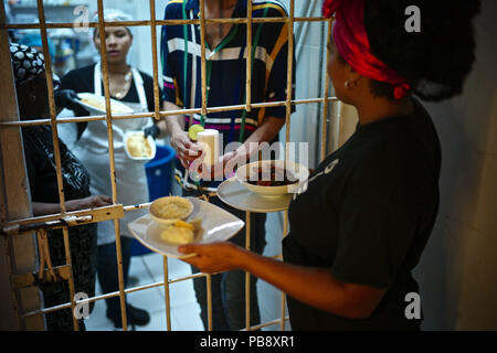 Cartagena De Indias, Bolivar, Colombia. 15th July, 2018. Interno is Cartagena's new prison restaurant, a space of reconciliation between the prison population and the civilian population, one of the enterprises from the FundaciÃ³n Interno Foundation, who works with current and former prisoners. The restaurant is located inside the San Diego women's prison. Inmates wearing pink turbans cook and serve the food to the visitors. The ambience is set within a renovated hall which still has bars over the door. Visitors can enjoy the Colombian dishes surrounded by the new pink walls, including f Stock Photo