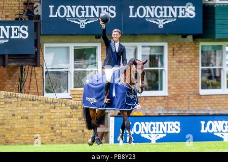 Hickstead, Sussex, UK. 27th July 2018. Winner. Kevin Jochems riding Captain Cooper. NED. The Longines BHS King George V Gold Cup. Prizegiving.  Longines FEI Jumping Nations Cup of Great Britain at the BHS Royal International Horse Show. All England Jumping Course. Hickstead. Great Britain. 27/07/2018. Credit: Sport In Pictures/Alamy Live News Stock Photo