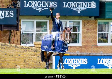 Hickstead, Sussex, UK. 27th July 2018. Winner. Kevin Jochems riding Captain Cooper. NED. The Longines BHS King George V Gold Cup. Prizegiving.  Longines FEI Jumping Nations Cup of Great Britain at the BHS Royal International Horse Show. All England Jumping Course. Hickstead. Great Britain. 27/07/2018. Credit: Sport In Pictures/Alamy Live News Stock Photo